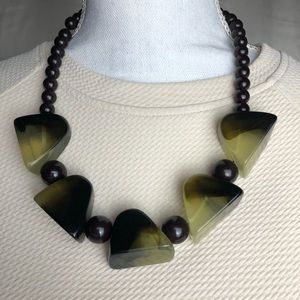 Black/pale yellow statement necklace.